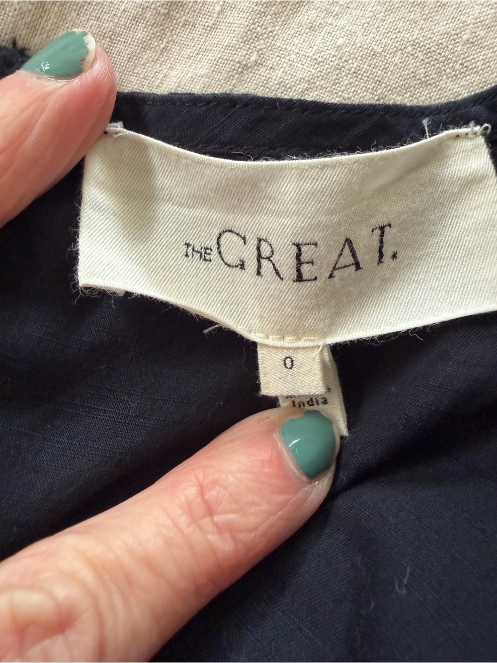 THE GREAT. Black Top with Branded Ivory Label